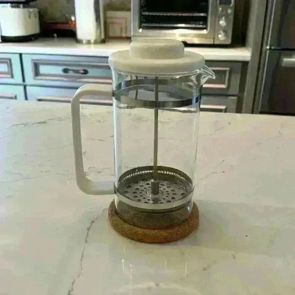 Vintage Bodum French press from the 80's with cork coaster